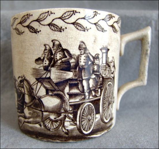 an earthenware mug made by George Hobson -  in the FIRE BRIGADE pattern 