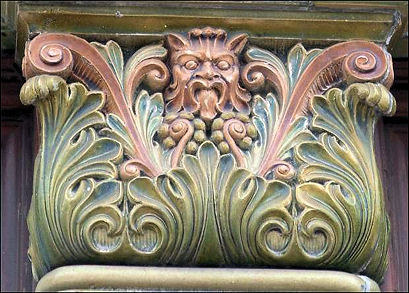ceramic capitals at Stoke Market depicting a Green Man-type face amongst foliage