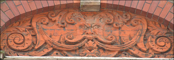 Green Man on the façade of building at corner of Pall Mall