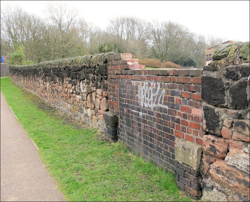 a previous gateway in the wall which was used for unloading raw materials for the pottery works 