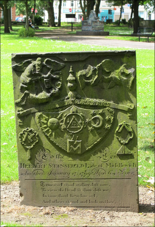 In the church grounds stands the headstone of Herbert Stansfield showing Masonic Symbols