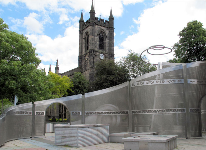The view of St. Peters through the sculpture 'Another Gift' on the corner of Kingsway and Glebe Street