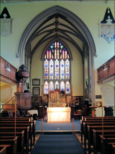 looking down the aisle and the nave to the chancel and altar 