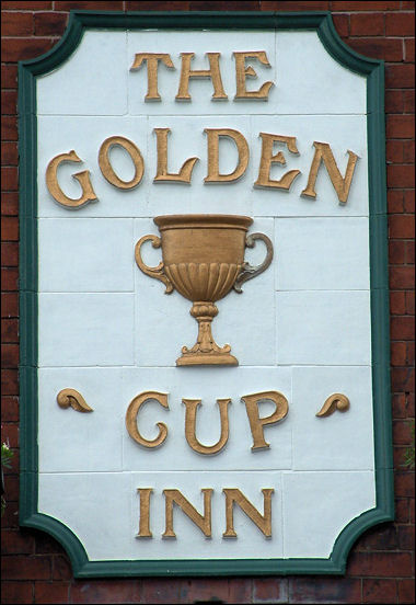 Golden Cup sign in tiles