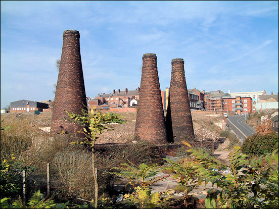 The back of Queen's Street, Burslem visible behind the kilns 