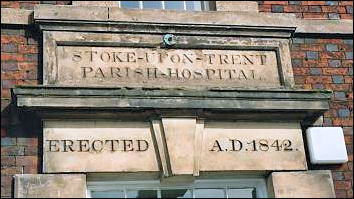 In the entablature of the entrance architrave, an inscription: "Stoke-on-Trent Parish Hospital erected AD 1842"