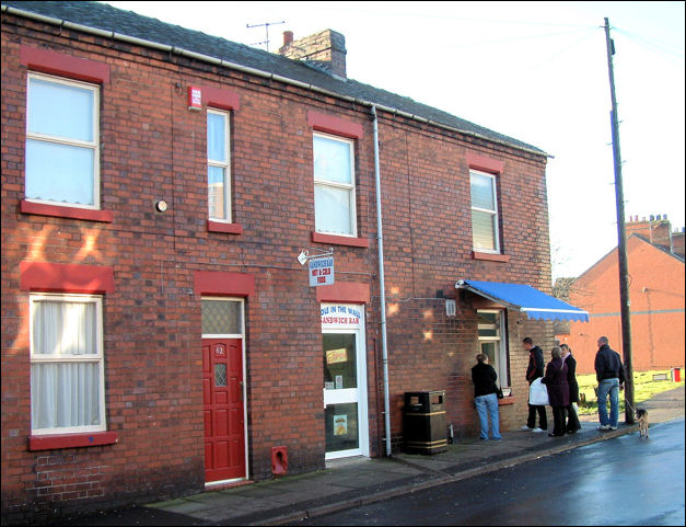 The shop sells oatcakes out on to the pavement, originally from a sash window,