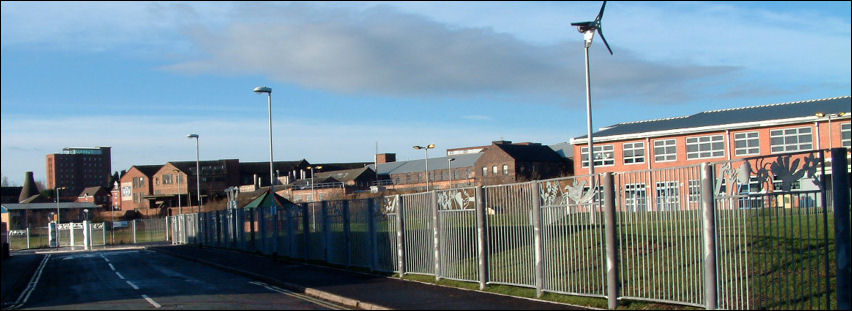 a view of the school and wind turbine 