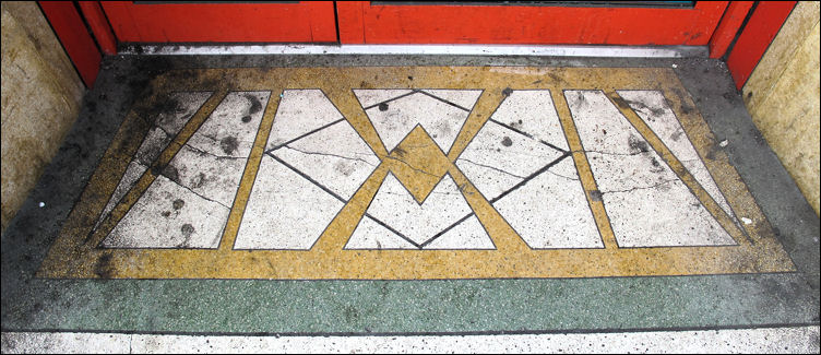 terrazzo step to the entrance with symetrical pattern 