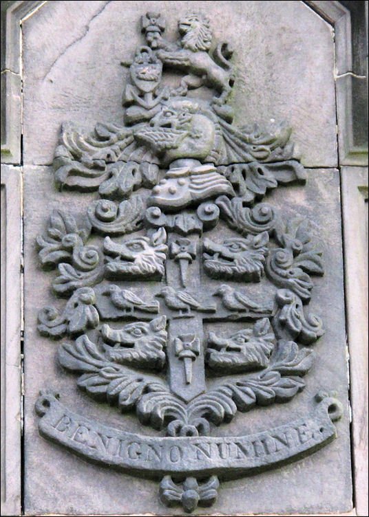 above the entrance are these arms - the motto 'Benigno Numine' translates as 'by the favour of heaven'