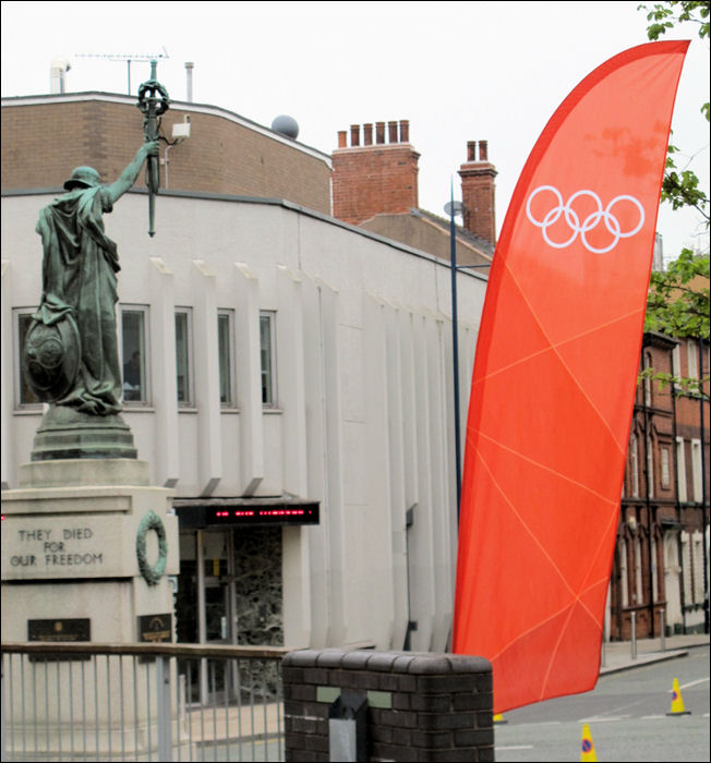 preparations for the torch relay - the olympic rings outside Hanley Town Hall 