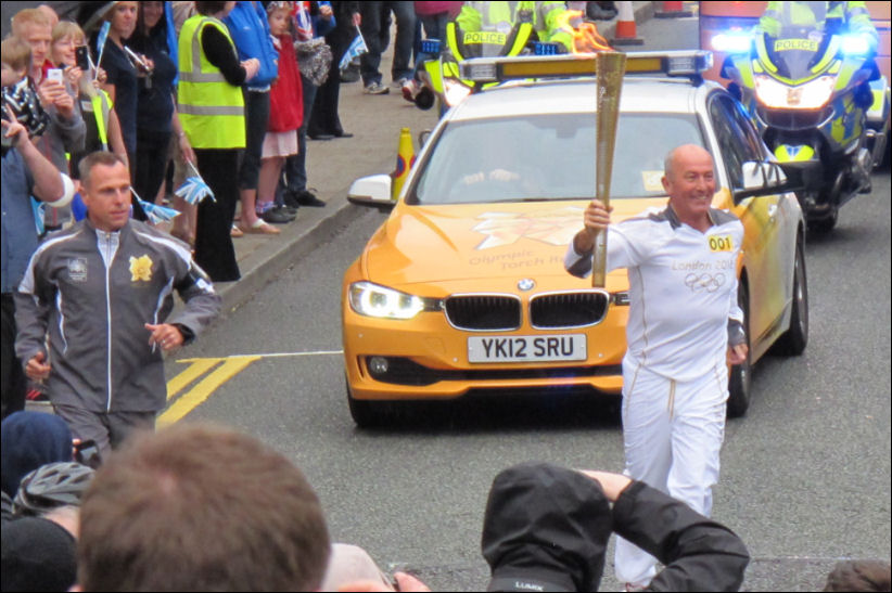 Tony Pulis makes his way up Albion Street on his stage of the relay 