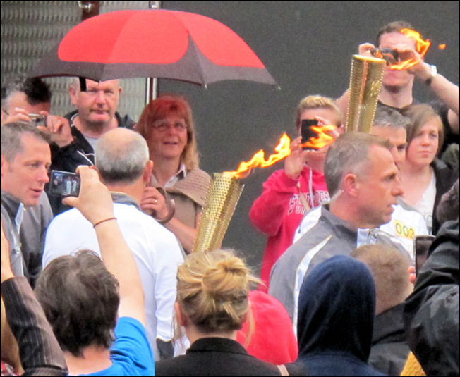 the exchange of the olympic flame outside Hanley Town Hall 