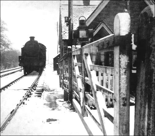 Snow on the ground of the mineral railway line crossing Birches Head Road, c.1953