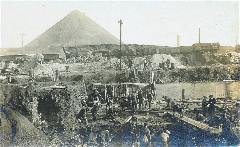 a hive of activity and in the background the spoil heap of the Racecourse Colliery 