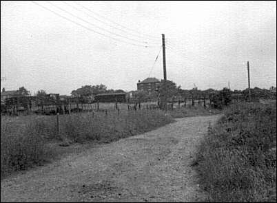 North westerly view up Heathside Lane over the allotments towards the British Legion Club