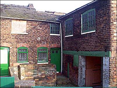Workshops and outhouses of the end terraced house