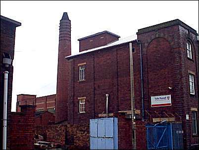 Yard and chimney behind the works