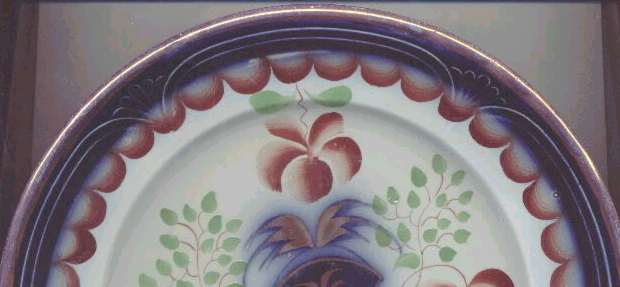 Flow Blue with Copper luster on the edges.