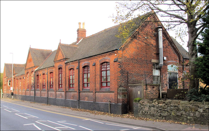 Brindley Ford First school, a late Victorian structure, the main building an imposing presence alongside the A527.