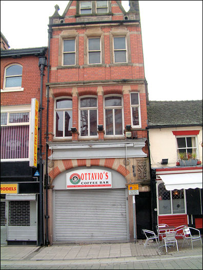 the panel on the faade of a coffee bar, over side access door