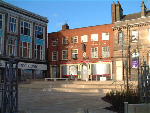 out of the front window  of the Steam Printing Works is Duck Square and the Duck Inn