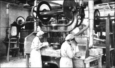 Tile making. All fettling dust is carried off by suction-draught hoods