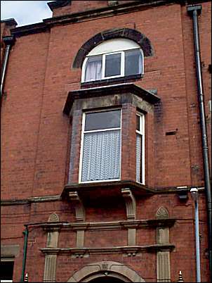 Detail of oriel window above the entrance