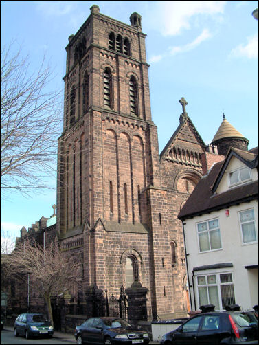 One big, square west tower and one smaller round one with a conical roof