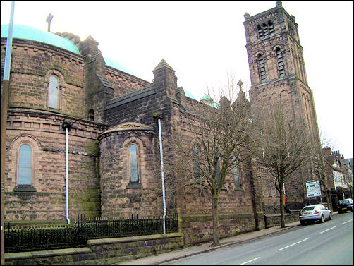 "Large and eager to impress. Romanesque, with three low domes and an apse"