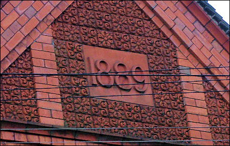 date stone '1889' over the public baths