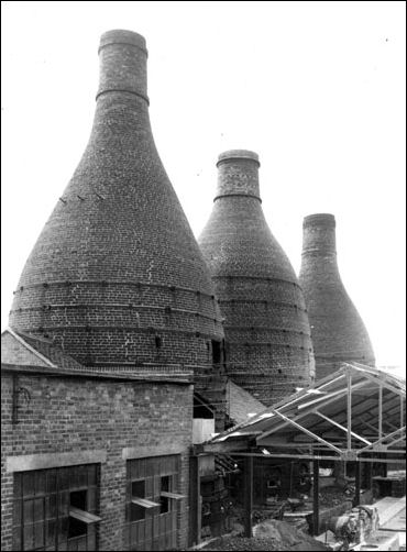 Pottery factory exterior with a view of the bottle ovens at the Dalehall Works, 