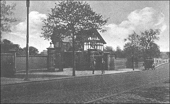 Postcard of the entrance gates and lodge