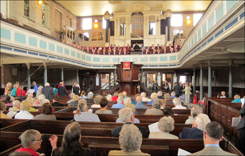 the chapel pews and gallery - under the organ is an octagonal pulpit