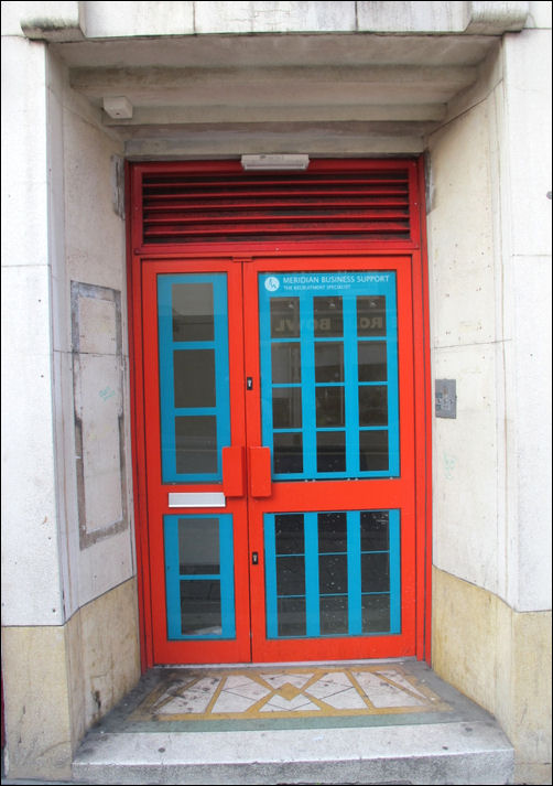 steel frame door and windows with the entrance sloping in to emphasise the door