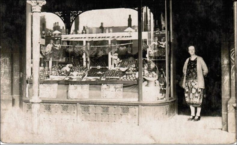 Minnie Hopkins in the doorway of one of the families greengrocers shops in Fenton