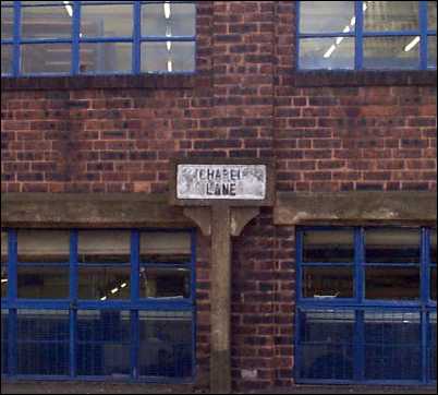 Chapel Lane sign which is against the back of the Royal Doulton print room.