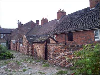 The rear of the cottages backs onto Tried Street and Port Vale Street.