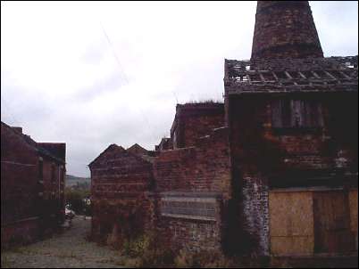 Note how close the cottages on the left are to the factory.