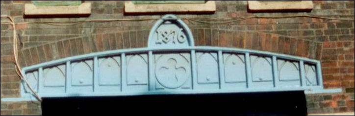 cast iron lintle and date "1876" over the entrance gate to the works 