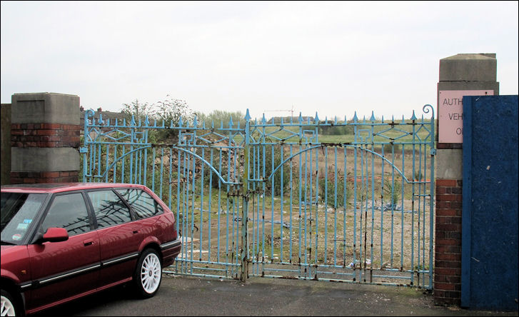 the gates of the Myott pottery works are all that remain at the end of Crane Street 