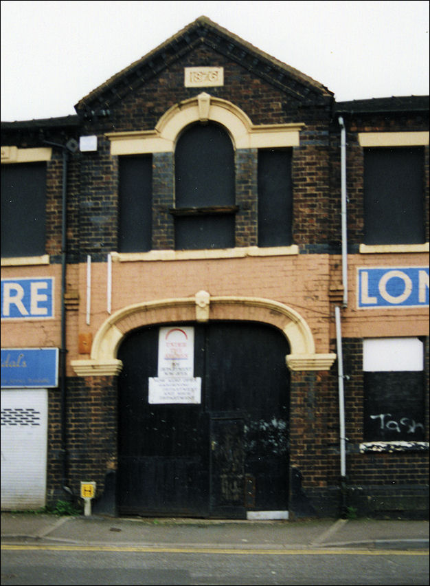 the arched entrance to the St. Louis Works, a Venetian Window above the entrance and a date stone of 1867 