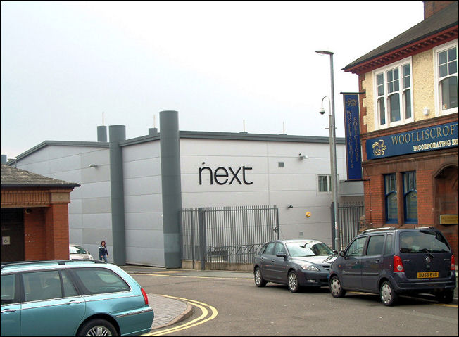 same view  in 2010 - the NEXT shop alongside Woolliscrofts Solicitors office 