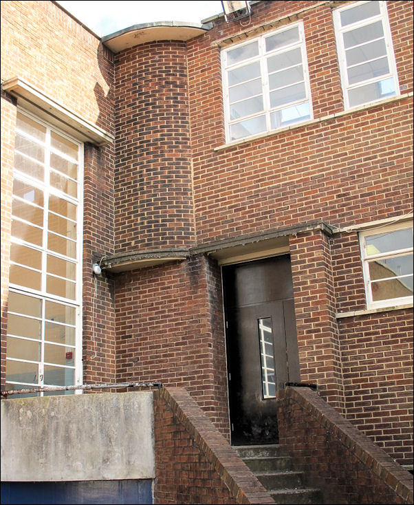 full height window and door of the gym compliments the corner features 