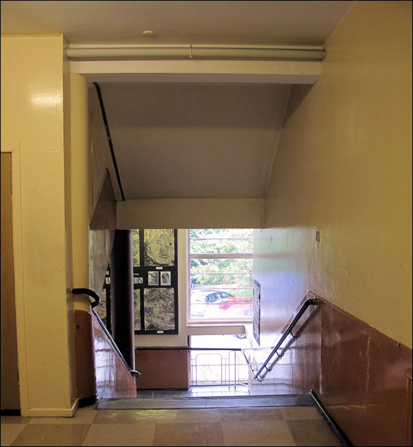 the front stairs - columns at the head and base of the stairs - the handrails curve around the columns 