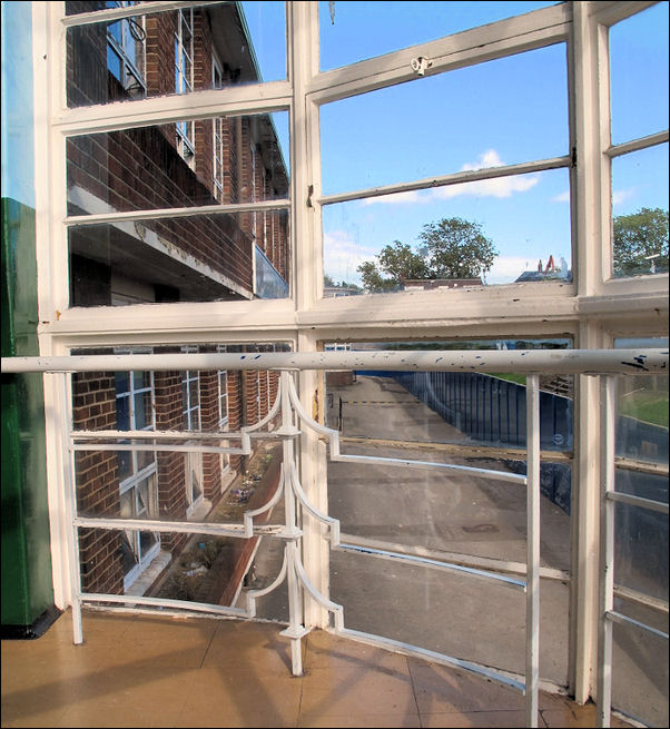 geometric ironwork pattern to the base of the windows 