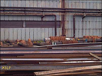 Scrap rolls and rolled product alongside the works 