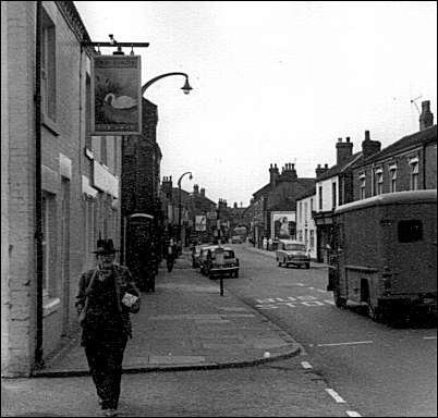 The Swan (left) - looking down the High Street