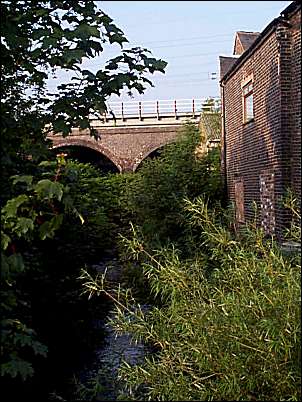 The river Trent as it flows under the railway bridge