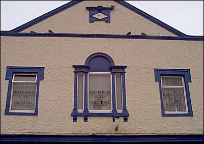 Central Palladian window in stuccoed architrave